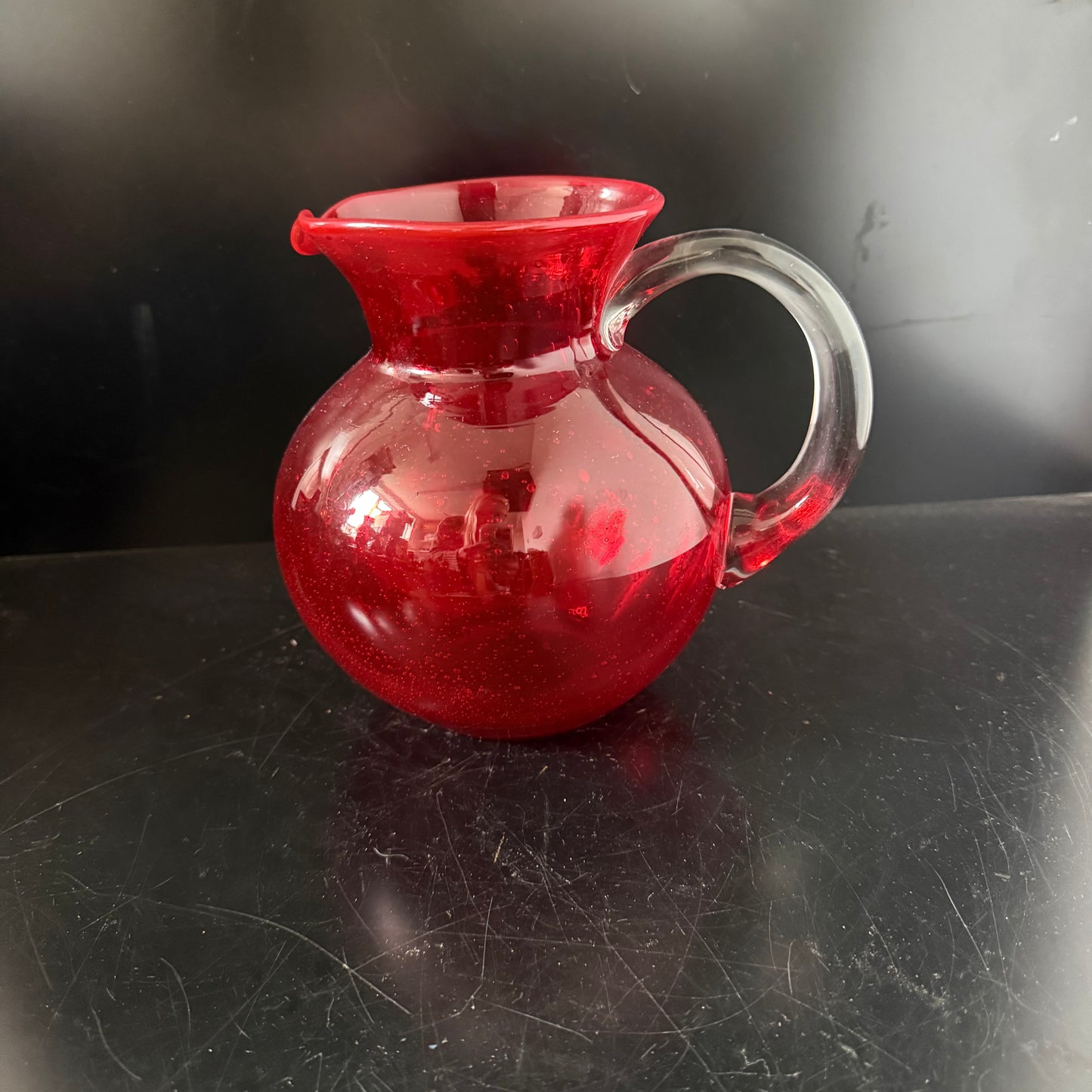 Red coloured glass jug