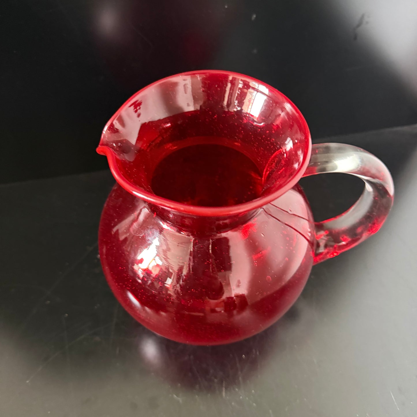Red coloured glass jug